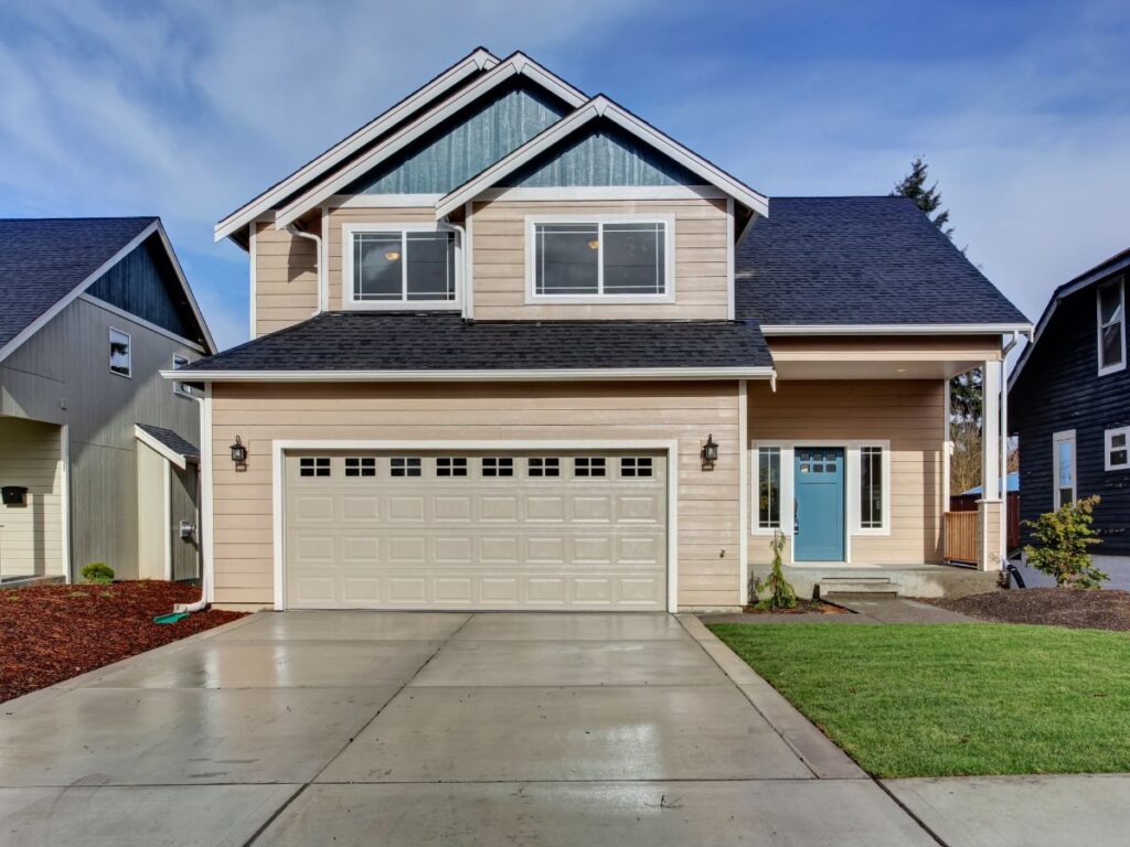 Two-story suburban home with garage and blue front door