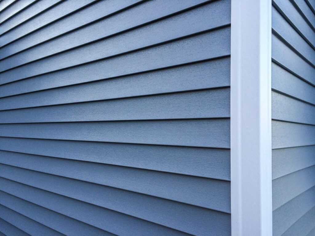 Clean blue house siding on an exterior corner